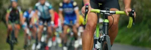 Cyclists in a race displaying determination and endurance, showcasing the challenge of breaking through a performance ceiling